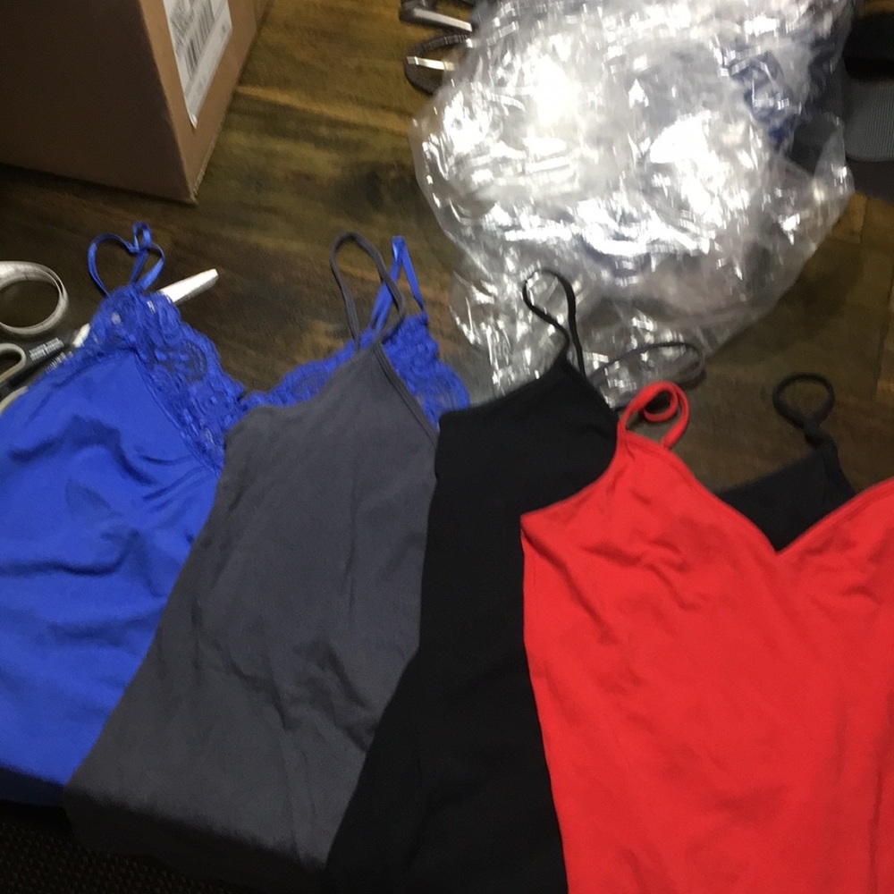 Four old navy tanks. Black grey red and blue S